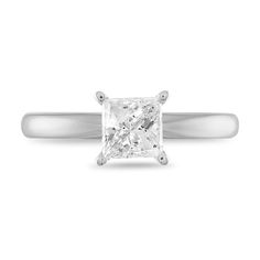 a princess cut diamond ring on a white background