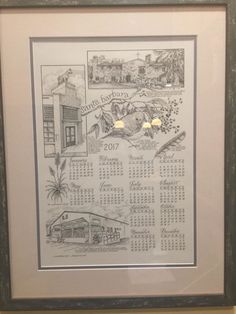 a framed calendar hanging on the wall