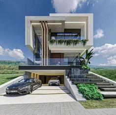 two cars parked in front of a modern house