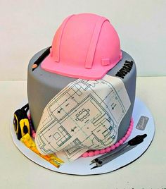 there is a cake that has construction equipment on it