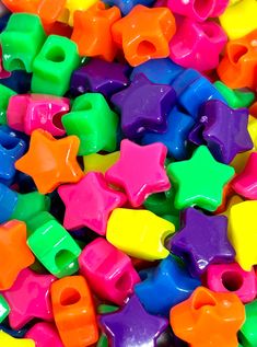 many different colored stars and shapes are scattered together