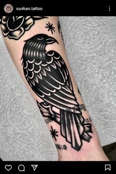 a black and white tattoo with an eagle on it's arm, in the middle of