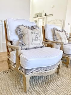 an old chair and ottoman with pillows on it in a room that is clean and ready for us to use