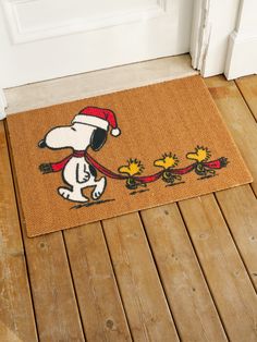 a door mat with a snoopy dog on it