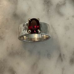 Size 6.5. Minimal Wear. Colorful And Bold, An Oval Faceted Garnet Set In 14k Gold Complements A Reflective Sterling Silver Hammered Band. Will Consider Reasonable Offers. Questions? Leave A Comment Below Modern Silver Ruby Ring With Polished Finish, Modern Silver Ruby Ring For Formal Occasions, Modern Sterling Silver Ruby Ring For Anniversary, Modern Silver Ruby Ring With Oval Shape, Modern Silver Ruby Rings, Modern Silver Rings With Ruby, James Avery Jewelry, Chunky Ring, Hammered Band