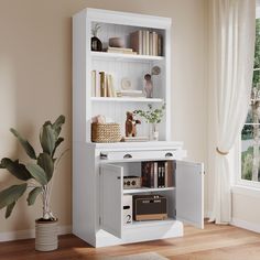 a white bookcase with books and other items in it