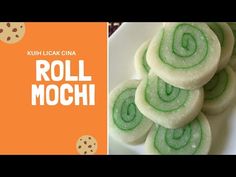 green and white cookies on a plate next to the words roll mochi