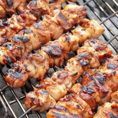 chicken skewers are being cooked on the grill