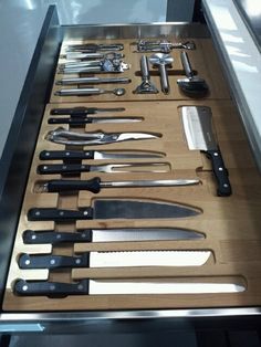 an assortment of kitchen utensils in a drawer