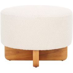 a white ottoman with wooden legs and a round cushion on it's back end