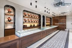 the inside of a jewelry store with glass displays