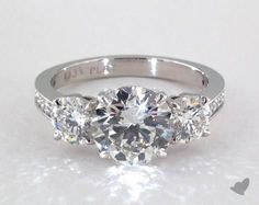 three stone engagement ring with diamond accents