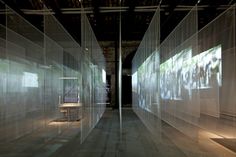 an empty room with large glass walls in it