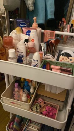 the inside of a white cart filled with cosmetics and personal care items, including toothbrushes