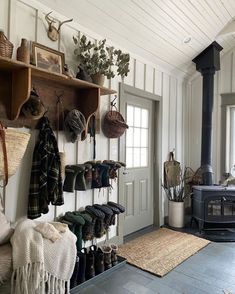 a room filled with lots of different types of hats and boots hanging on the wall