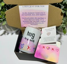 a gift box containing a mug, coasters and note cards for someone's special day