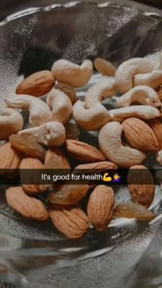 almonds and cashews in a glass bowl with the words it's good for health