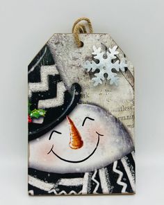 a tag with a snowman face on it