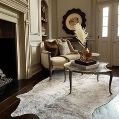 a living room filled with furniture and a fire place