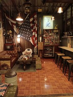 a living room filled with furniture and an american flag on the wall