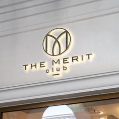 the merit club sign is lit up above the entrance to the restaurant's front door