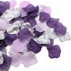 purple and silver flowers are scattered on a white background