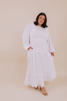 Look positively heavenly in PLUS SIZE - The White: Monica! This LDS temple dress is divine, featuring a maxi length skirt with long sleeves and charming ruffle details. A comfortable elastic waistband ensures a secure fit so you can glide around like an angel. Get to floatin'! Details White dress Maxi-length Long sleeves Fully lined Pockets! High rounded neck Keyhole button closure Double elastic waistband LDS temple dress Sizing Approximate measurements: SIZE LENGTH BUST WAIST* 1XL 58" 46" 35" Vacation White Maxi Dress With 3/4 Sleeve, White Casual Maxi Dress With 3/4 Sleeves, White Maxi-length Smocked Dress For Beach, Spring White Long-sleeve Peasant Dress, Lds Temple Dress, White Floor-length Maternity Maxi Dress, Temple Dress, Lds Temple, Lds Temples