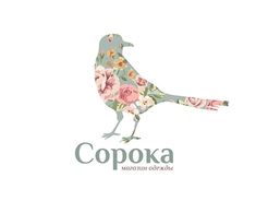 a bird with flowers on it's body and the word copoka written in russian