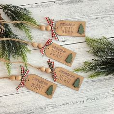 three wooden tags with christmas trees on them