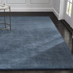 a blue area rug in a living room