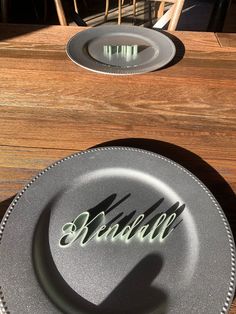 two plates sitting on top of a table next to each other with the word believe written on them