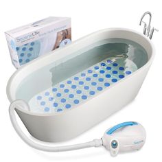 a bathtub with blue and white polka dots on it, next to a hair dryer