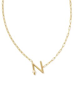 Let your personality pop when you wear the Pearl Gold Letter N Short Pendant Necklace in White Pearl. This oversized, angled letter pendant will really put you front and center (because where else would you be?). Topped with a cultured freshwater pearl for that extra wow factor, there’s no way people won’t be asking about this must-have layerable. 19' CHAIN, 0.75"L X 0.74"W PENDANT N Necklace, Icon Jewelry, Short Pendant Necklace, Pearl Letters, Buy Pearls, Kendra Scott Necklace, Gold Letter, Letter N, Letter Pendants