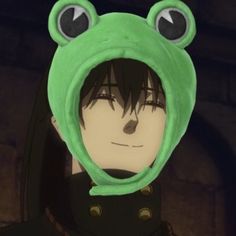 a person wearing a frog costume with big eyes and a hoodie over their head