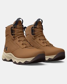 the under armour boots are tan and brown