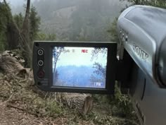 a car is parked on the side of a road with a camera attached to it