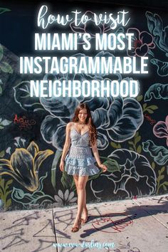 a woman standing in front of a wall with the words how to visit miami's most instagramable neighborhood