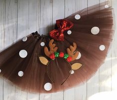 a brown and white polka dot skirt with reindeer antlers on it