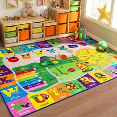 a child's play area with toys and bookshelves on the floor in front of a window