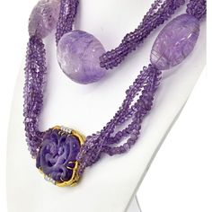 Indulge in the captivating allure of this exquisite David Webb Lavender Bead Necklace. Handcrafted with meticulous attention to detail, this necklace is a testament to the brand's impeccable craftsmanship. Each of the five strands features lustrous amethyst beads, showcasing their enchanting lavender hue.Adding to its allure are the large egg-shaped amethyst stations, creating a striking focal point. These impressive amethysts, measuring about 4.5cm in length and 10cm in diameter, exude a sense Luxury Purple Jewelry With Round Beads, Luxury Amethyst Gemstone Beads Jewelry, Luxury Yellow Gold Amethyst Necklace, Luxury Amethyst Necklace For Formal Occasions, Exquisite Purple Necklace, Elegant Lavender Amethyst Gemstone, Exquisite Formal Amethyst Necklace, Elegant Lavender Necklaces With Natural Stones, Exquisite Amethyst Necklace For Formal Occasions