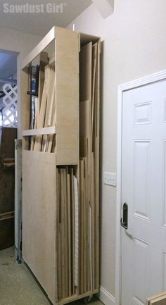 an unfinished cabinet is open and ready to be used as a storage unit for books