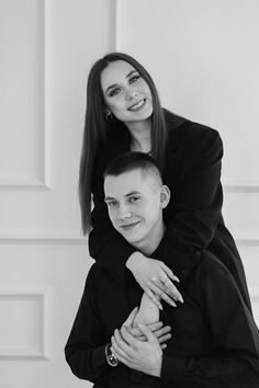 black and white photo of two people hugging each other