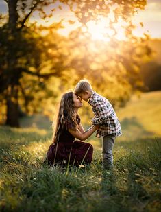 A mother and her young son touch foreheads and snuggle as the sun sets behind them. Fall Mommy And Son Pictures, Family Poses For 4, Fall Picture Poses For Family, Mother And Sons Photo Ideas, Red Truck Family Pictures, Outdoor Photoshoot Ideas Family Of 4, Family If 3 Photoshoot, Cute Family Poses, Family Of 3 Fall Photo Ideas