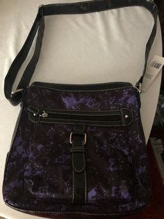 VERY NICE ROSETTI SHOULDER BAG! MADE WITH 100% POLYESTER WITH VINYL TRIM ~ANERICAN FAVORITE HANDBAGS`NICE LONG SHOULD STRAP THAT CAN BE DOUBLE UP. BLACK WITH SPLASHES OF PURPLE, ACTUAL PHOTOS HAVE BENN TAKE! ZIPPER COMPARTMENT I ON THE FRONT, & ON THE BACK & ON THE INSIDE DOWN THE MIDDLE AND ON THE SIDE OF THE BAG! SO YOU WILL HAVE PLENTY OF ROOM FOR ALL YOUR PERSONAL BELONGING! WOW SO PRETTY! Purple Cross Body Bag, Purple Crossbody Bag, Purple Shoulder Bag With Zipper Pocket, Purple Shoulder Bag With Zipper Pocket For School, Purple Shoulder Bag For School With Zipper Pocket, Casual Purple Satchel Shoulder Bag, School Shoulder Bag With Zipper Pocket In Purple, Purple Crossbody Bag With Zipper Closure, Purple Crossbody Bag With Zipper Pocket