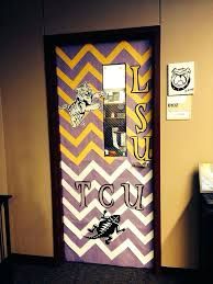 a door decorated with purple and yellow chevrons, the words lsu on it