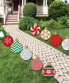 an image of christmas decorations on the lawn with text that reads, ornament shaped lawn decorations outdoor christmas decorations - ornaments