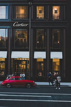 a red car parked in front of a tall building with the words, did you know that going away for college can actually get you a discount?