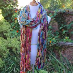 a mannequin wearing a multicolored scarf