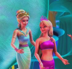 two barbie dolls standing next to each other in front of a blue and green background