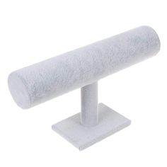 a white towel is sitting on a stand